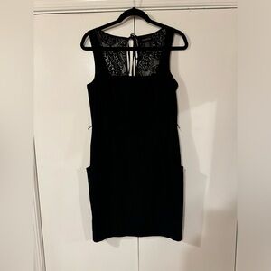 Black fitted dress with pockets, excellent condition, size 11.